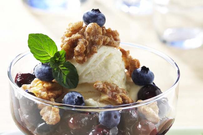 Frozen Yogurt Sundae With Blueberry Compote and Glazed Walnuts